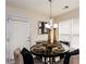 Inviting dining area with a round table, elegant place settings, and natural light from the windows at 6245 Hickory Lane Cir, Union City, GA 30291