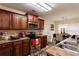 Well-equipped kitchen featuring wood cabinets, stainless steel appliances, and adjacent dining area at 6245 Hickory Lane Cir, Union City, GA 30291