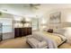 Bright primary bedroom features neutral tones, large windows, and an ensuite bathroom at 6245 Hickory Lane Cir, Union City, GA 30291