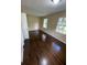 Bedroom featuring hardwood floors with natural light coming in through the windows at 6399 Boca Grande Blvd, Forest Park, GA 30297