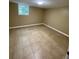 Neutral colored bedroom with tile floors and natural light at 6399 Boca Grande Blvd, Forest Park, GA 30297