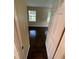 View of the hardwood floors in a bedroom with natural light coming in through the windows at 6399 Boca Grande Blvd, Forest Park, GA 30297