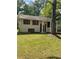 Charming home with a well-maintained lawn and mature trees in a serene and quiet neighborhood at 6399 Boca Grande Blvd, Forest Park, GA 30297