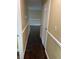Hallway featuring hardwood floors and neutral paint, perfect for any decor at 6399 Boca Grande Blvd, Forest Park, GA 30297