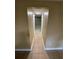 Hallway showing tile flooring and neutral colored walls throughout at 6399 Boca Grande Blvd, Forest Park, GA 30297