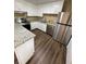Galley style kitchen features stainless appliances, granite counters, and ample counter space at 6399 Boca Grande Blvd, Forest Park, GA 30297