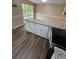 Bright eat-in kitchen with peninsula, stone counters and a view to the backyard at 6399 Boca Grande Blvd, Forest Park, GA 30297