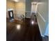 View of main living room, hardwood floors, and stairway at 6399 Boca Grande Blvd, Forest Park, GA 30297