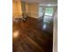 Open-concept home featuring hardwood floors, neutral walls, open to kitchen and outdoor views at 6399 Boca Grande Blvd, Forest Park, GA 30297