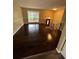 Bright living room featuring polished hardwood floors, neutral paint and abundant natural light at 6399 Boca Grande Blvd, Forest Park, GA 30297