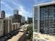 High-rise apartment buildings with a mix of commercial buildings below and a sunny sky above at 1101 Juniper Ne St # 1506, Atlanta, GA 30309