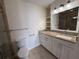 Bright bathroom featuring a granite countertop, white cabinetry, and a glass-enclosed shower at 1101 Juniper Ne St # 1506, Atlanta, GA 30309