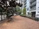 Community dog park with secure fencing, mature trees, and convenient seating at 1101 Juniper Ne St # 1506, Atlanta, GA 30309