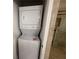 Washer and dryer in a utility closet next to a shower at 1101 Juniper Ne St # 1506, Atlanta, GA 30309