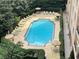 A beautiful community pool surrounded by lounge chairs, umbrellas, and lush greenery, perfect for relaxation at 1101 Juniper Ne St # 1506, Atlanta, GA 30309