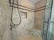 Shower featuring neutral tile, seat, and shower niche at 1101 Juniper Ne St # 1506, Atlanta, GA 30309