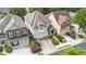 Aerial view of townhomes showing well-maintained lawns, driveways, and landscaping at 4230 Glen Vista Ct, Duluth, GA 30097