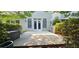 Backyard view with concrete patio and lush landscaping at 4230 Glen Vista Ct, Duluth, GA 30097