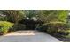 Backyard view with concrete patio and lush landscaping at 4230 Glen Vista Ct, Duluth, GA 30097