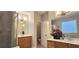 Modern bathroom featuring dual vanities, wood cabinets, tiled shower, and ample space for a luxurious feel at 4230 Glen Vista Ct, Duluth, GA 30097