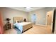 This bedroom features a tray ceiling, neutral colors, lots of light, and modern decor for a comfortable ambiance at 4230 Glen Vista Ct, Duluth, GA 30097