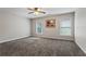 Spacious bedroom with carpet, ceiling fan, and windows offering natural light, creating a cozy retreat at 4230 Glen Vista Ct, Duluth, GA 30097