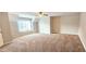 Large bonus room offering generous space with neutral carpet, a ceiling fan, and a versatile layout at 4230 Glen Vista Ct, Duluth, GA 30097