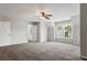 Bright bonus room with carpet, ceiling fan and a window for natural light, ideal for a home office or playroom at 4230 Glen Vista Ct, Duluth, GA 30097