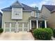 Charming two-story home featuring a two-car garage, stone accents, and well-maintained landscaping at 4230 Glen Vista Ct, Duluth, GA 30097
