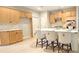 Bright kitchen with light wood cabinets, center island with seating, and modern appliances at 4230 Glen Vista Ct, Duluth, GA 30097