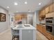 Bright kitchen featuring an island with marble countertop and stainless steel appliances at 4230 Glen Vista Ct, Duluth, GA 30097
