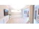 Elegant living area showcasing a modern chandelier, wood-look floors, and decorative wall molding at 4230 Glen Vista Ct, Duluth, GA 30097
