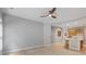 Spacious living room next to the kitchen features wood floors and gray paint at 4230 Glen Vista Ct, Duluth, GA 30097