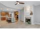 Open-concept kitchen flows to the living room with a fireplace and a ceiling fan at 4230 Glen Vista Ct, Duluth, GA 30097