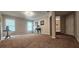 Expansive living room with neutral carpet, natural light, and decor for an inviting and comfortable ambiance at 4230 Glen Vista Ct, Duluth, GA 30097