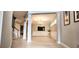 Elegant living area showcasing a modern chandelier, wood-look floors, and decorative wall molding at 4230 Glen Vista Ct, Duluth, GA 30097