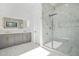 Modern bathroom featuring a double vanity, glass shower and marble tiling at 5175 Cascade Rd, Atlanta, GA 30331