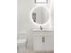 Bathroom featuring an illuminated round mirror above a vanity and a modern toilet at 5175 Cascade Rd, Atlanta, GA 30331