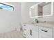 Modern bathroom with marble countertop, white cabinetry, and a recessed lighted mirror at 5175 Cascade Rd, Atlanta, GA 30331