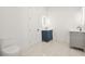 Bathroom featuring double sinks with modern vanities and a toilet in a well-lit space at 5175 Cascade Rd, Atlanta, GA 30331