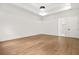 Spacious bedroom with hardwood floors, tray ceiling, and modern lighting at 5175 Cascade Rd, Atlanta, GA 30331