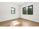 Bright bedroom with hardwood floors and natural light from two windows at 5175 Cascade Rd, Atlanta, GA 30331