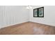 Bedroom with wood floors, natural lighting, and white accent wall at 5175 Cascade Rd, Atlanta, GA 30331