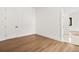 Bright and airy bedroom with hardwood floors featuring two doorways and natural light at 5175 Cascade Rd, Atlanta, GA 30331