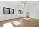 Bedroom with wood floors, ceiling fan, natural lighting, and ensuite walk-in closet at 5175 Cascade Rd, Atlanta, GA 30331
