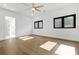 Bedroom featuring modern fan, recessed lighting, wood floors, and ensuite bathroom at 5175 Cascade Rd, Atlanta, GA 30331