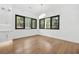 Sunlit dining area with sleek hardwood floors and stylish modern lighting at 5175 Cascade Rd, Atlanta, GA 30331