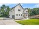 Striking two-story home with a black framed garage door and a lush green yard at 5175 Cascade Rd, Atlanta, GA 30331