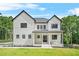 Stunning modern farmhouse featuring a manicured lawn and stylish black framed windows at 5175 Cascade Rd, Atlanta, GA 30331