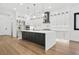 Modern kitchen with a large island, stainless steel appliances, and white cabinets at 5175 Cascade Rd, Atlanta, GA 30331